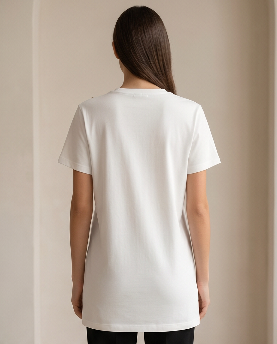 Asimple yet elegant white t-shirt featuring unique gold chain detailing on the shoulders and front, perfect for a sophisticated casual look